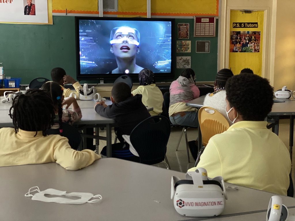 Students using virtual reality headsets during a Vivid Imagination classroom lesson