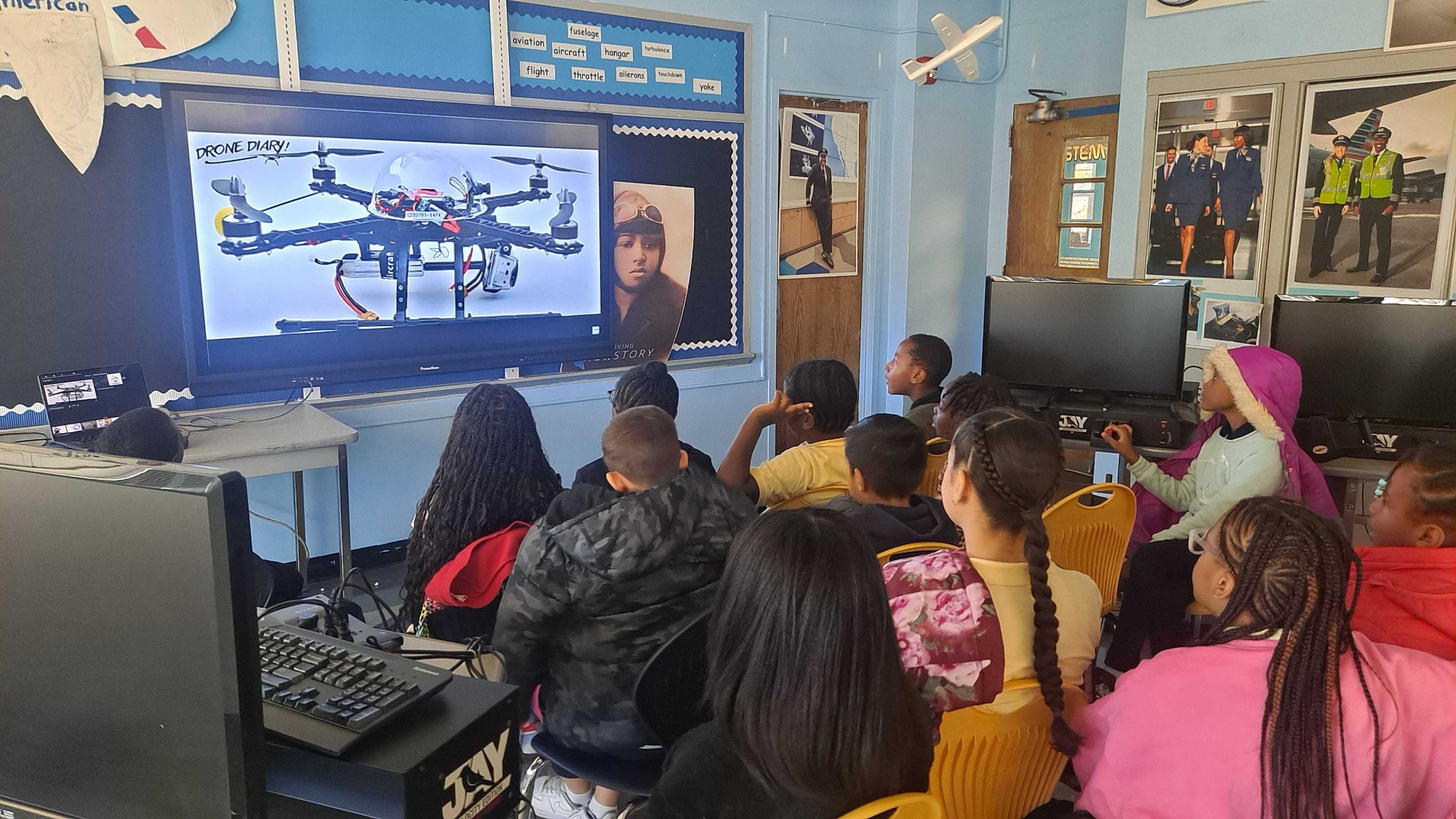 Students learning about drones and aviation in a Vivid Imagination classroom