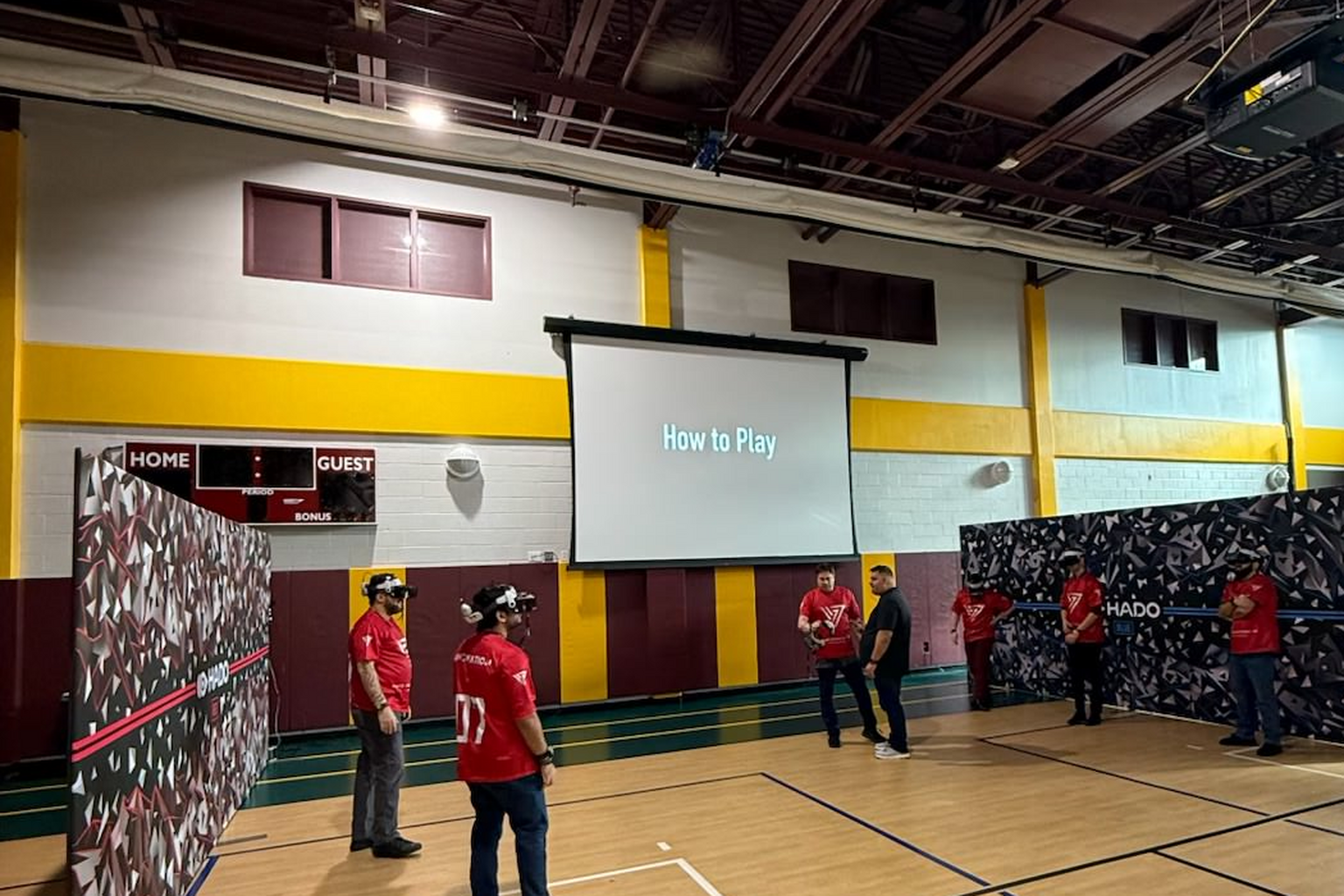 Participants wearing HADO headsets inside a branded HADO arena